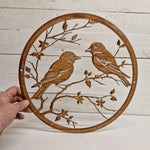 Rusted Metal Birds On Branch In Circular Frame