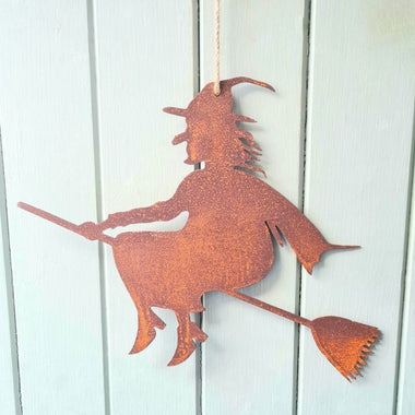 Rusted Metal Witch On Broomstick