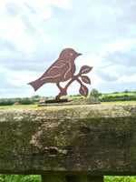 Rusted Metal Bird on Branch